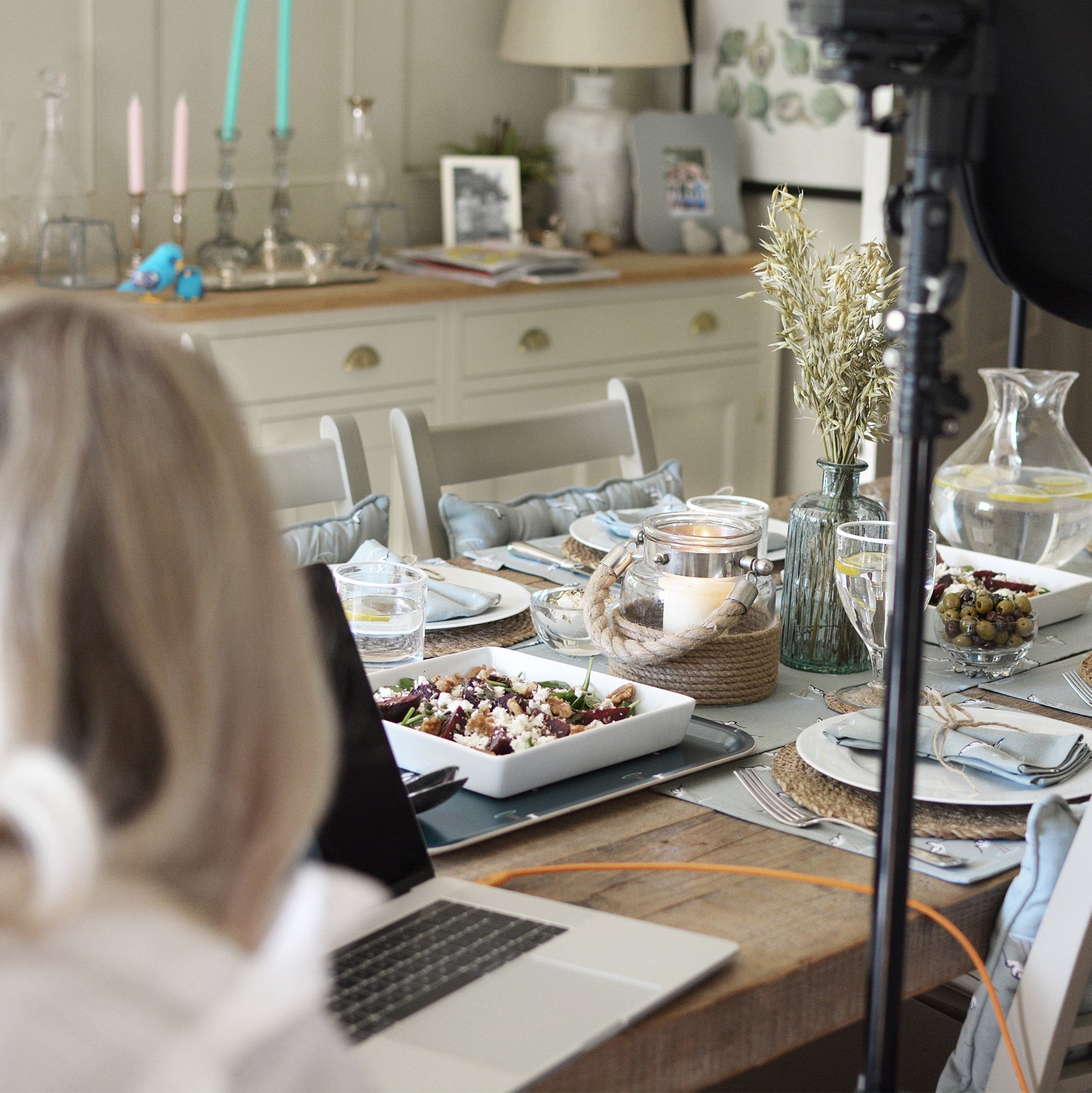 We step behind the scenes at Sophie Allports new coastal collection which features Avocets on a sea-blue background. We see our photographer capturing a coastal table setting.