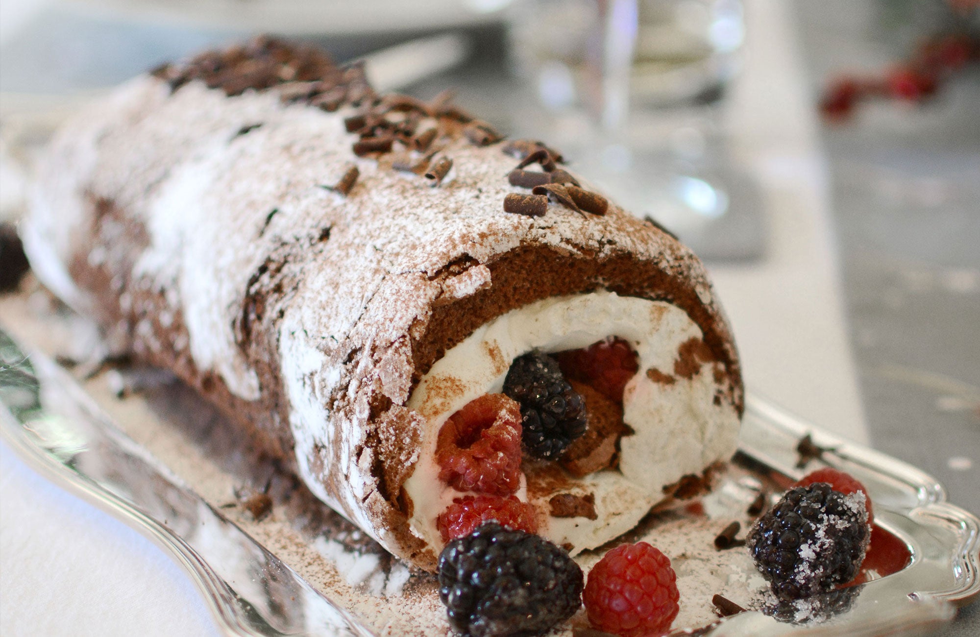 Simple chocolate roulade recipe with berries. Make a great Christmas yule log.