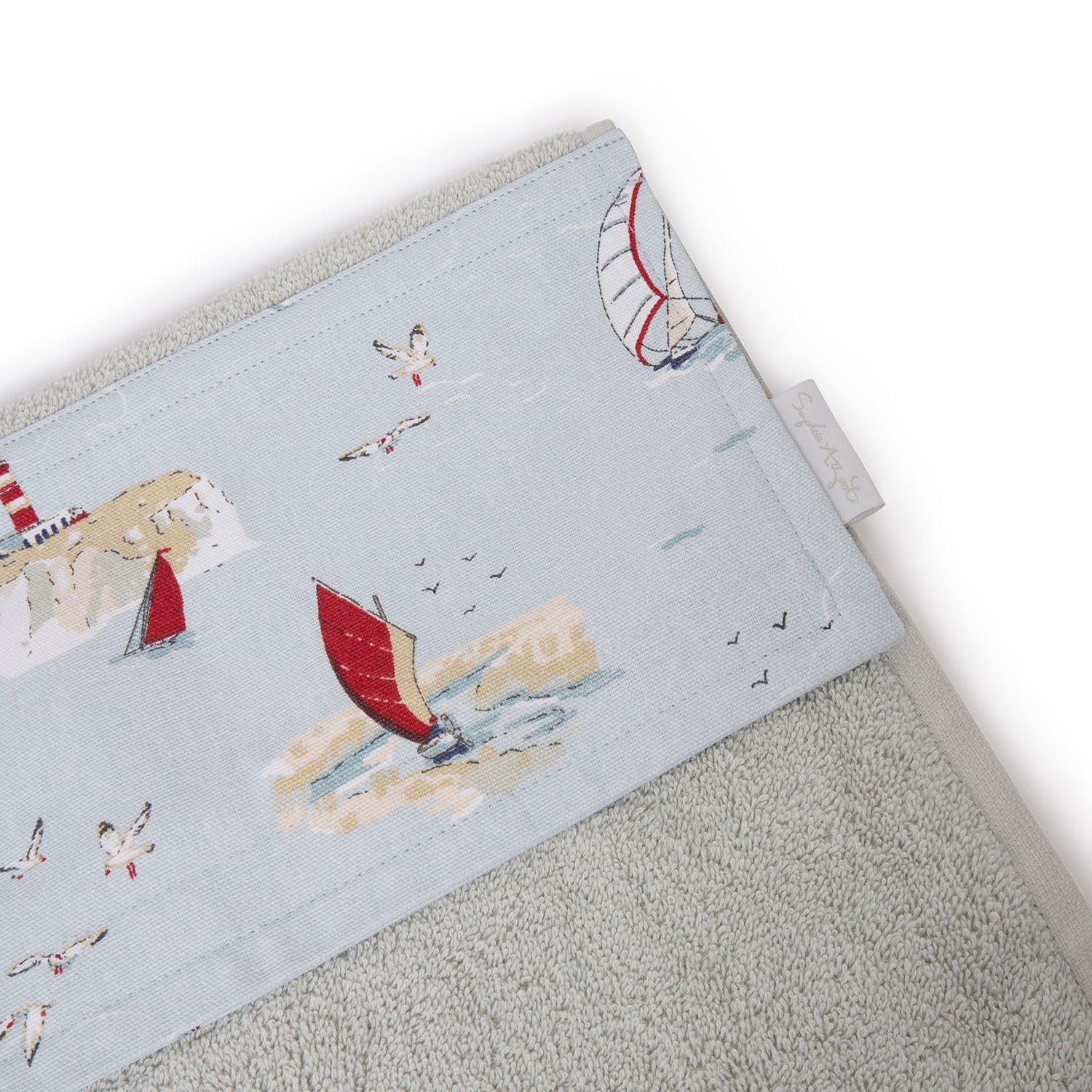 Roller hand towel with coastal sailing boats print by Sophie Allport tag detail