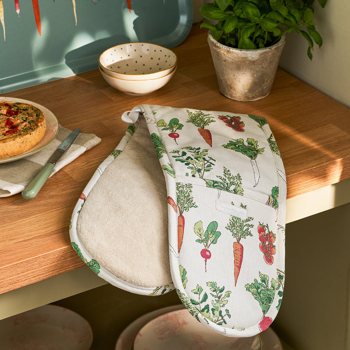 Beige double oven glove with garden vegetables print by Sophie Allport