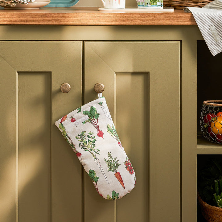 Beige oven mitt with garden vegetables print by Sophie Allport