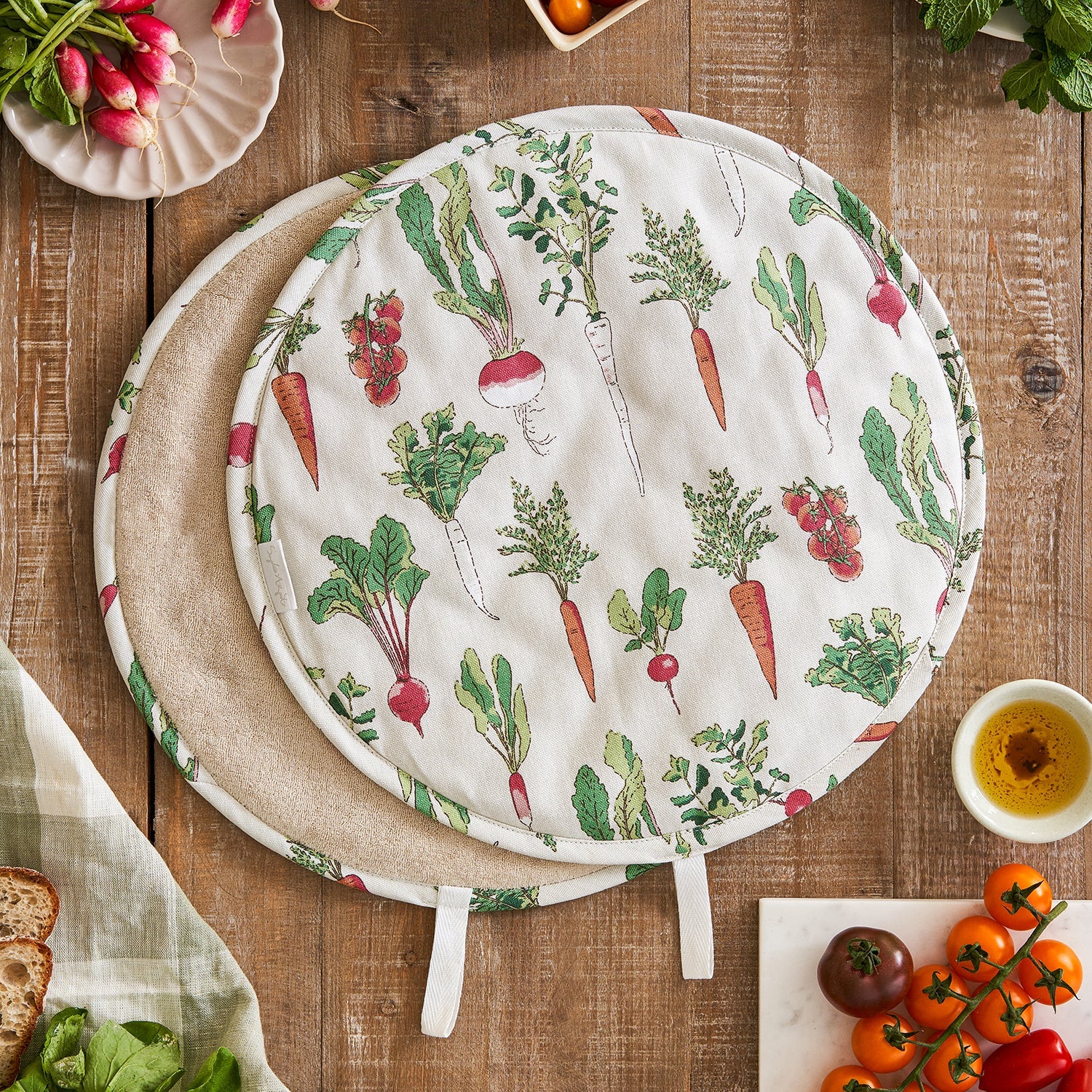Beige hob covers with garden vegetables print by Sophie Allport