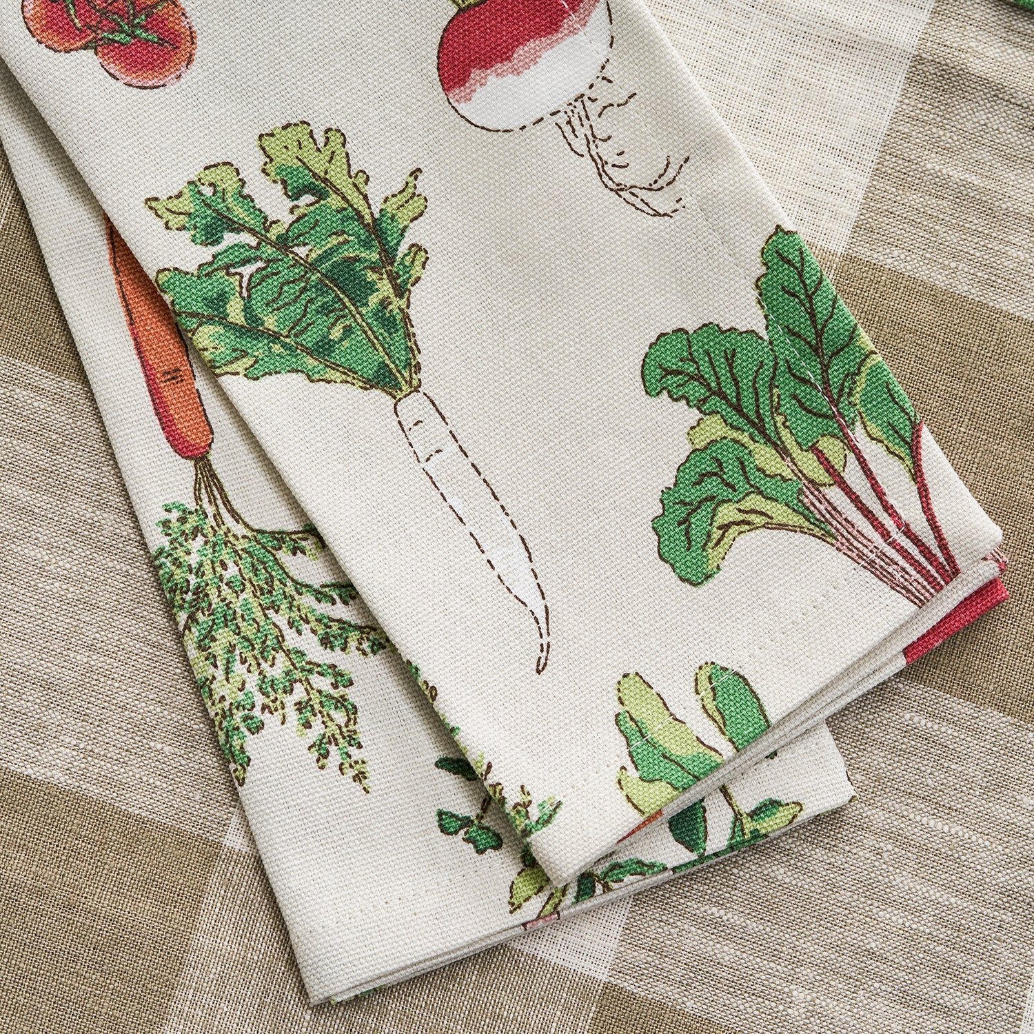 Beige napkins with garden vegetables print by Sophie Allport detail
