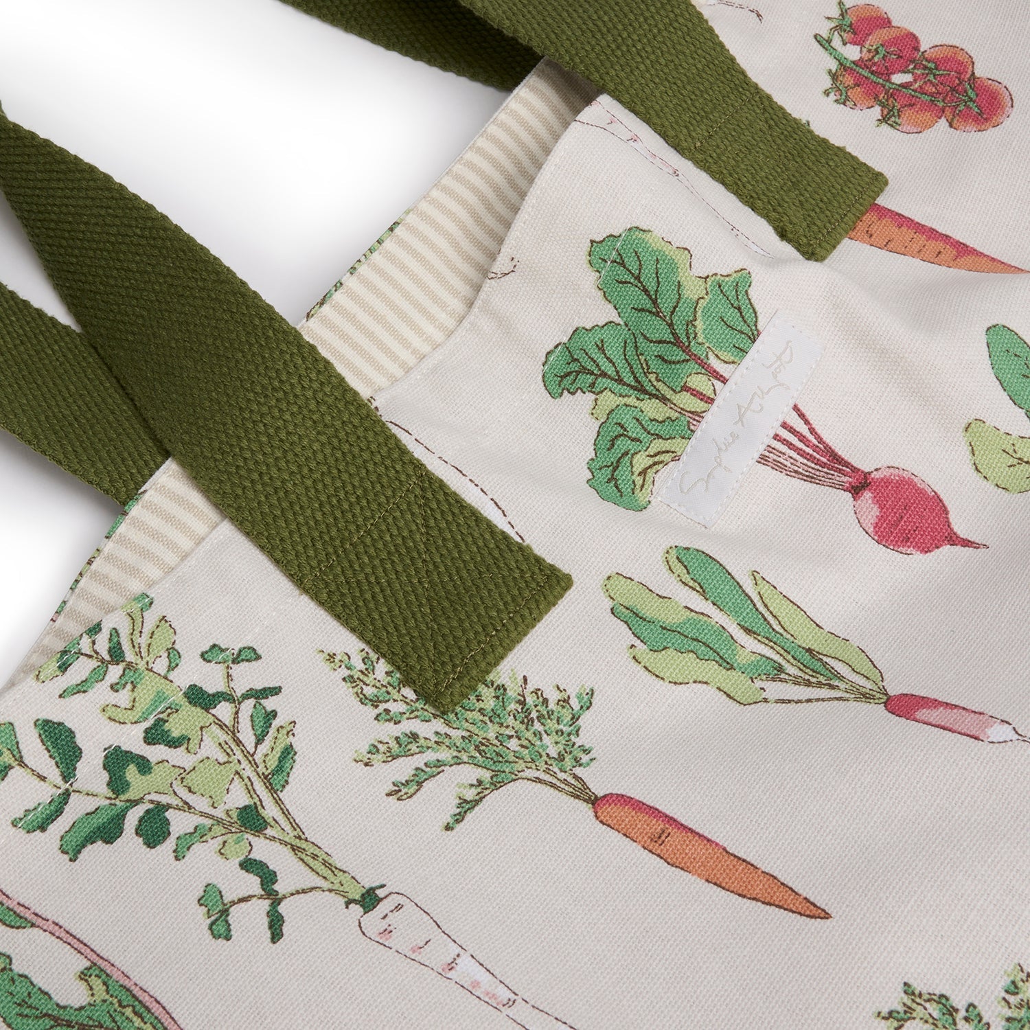 Beige cotton bag with garden vegetables print by Sophie Allport strap detail