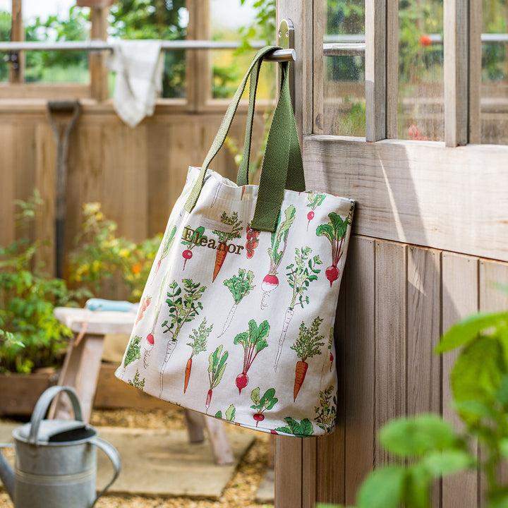 Beige cotton bag with garden vegetables print by Sophie Allport