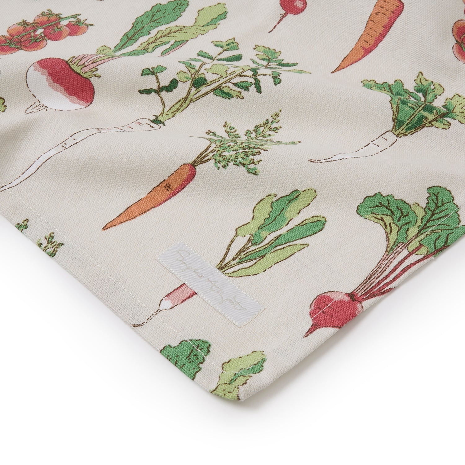 Beige table runner with garden vegetables print by Sophie Allport corner detail