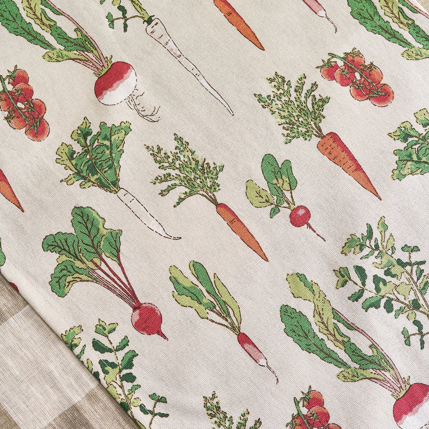 Beige table runner with garden vegetables print by Sophie Allport detail
