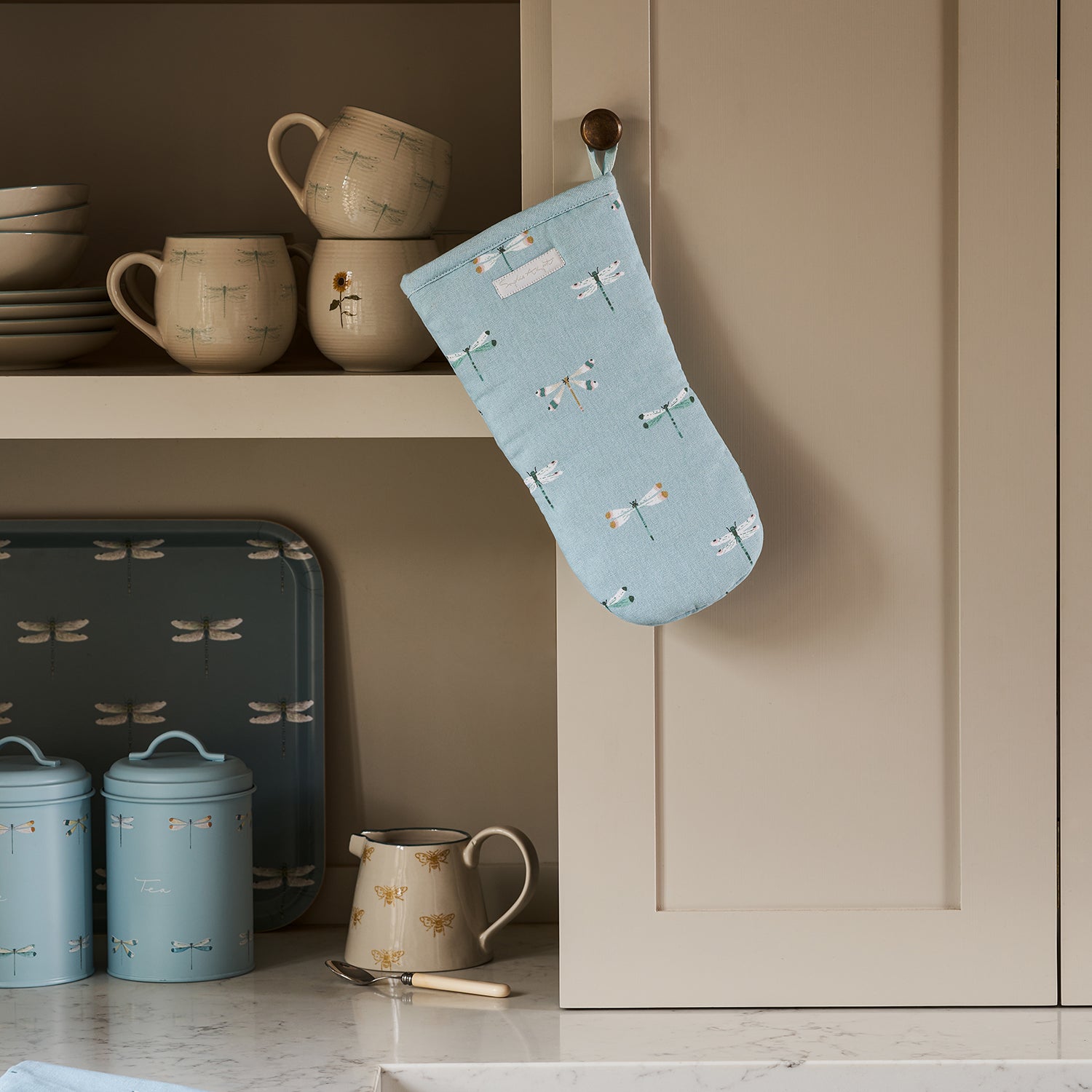 Blue oven mitt with dragonfly print by Sophie Allport
