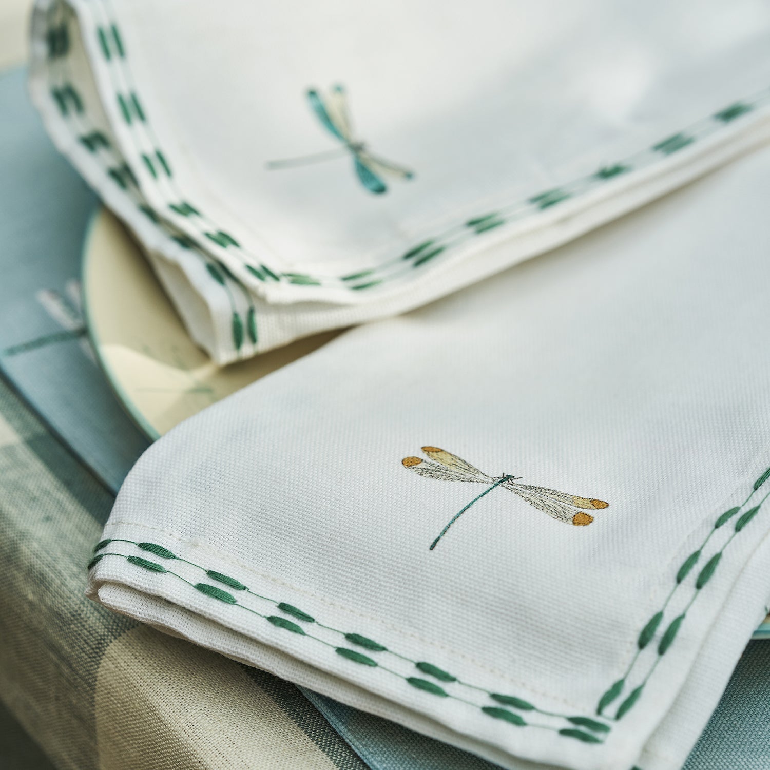 White embroidered napkins with dragonfly print by Sophie Allport detail