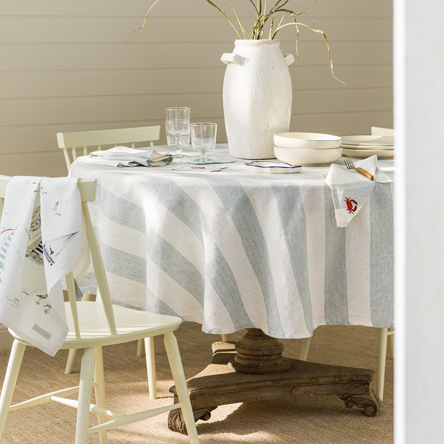 Blue and white coastal round tablecloth by Sophie Allport