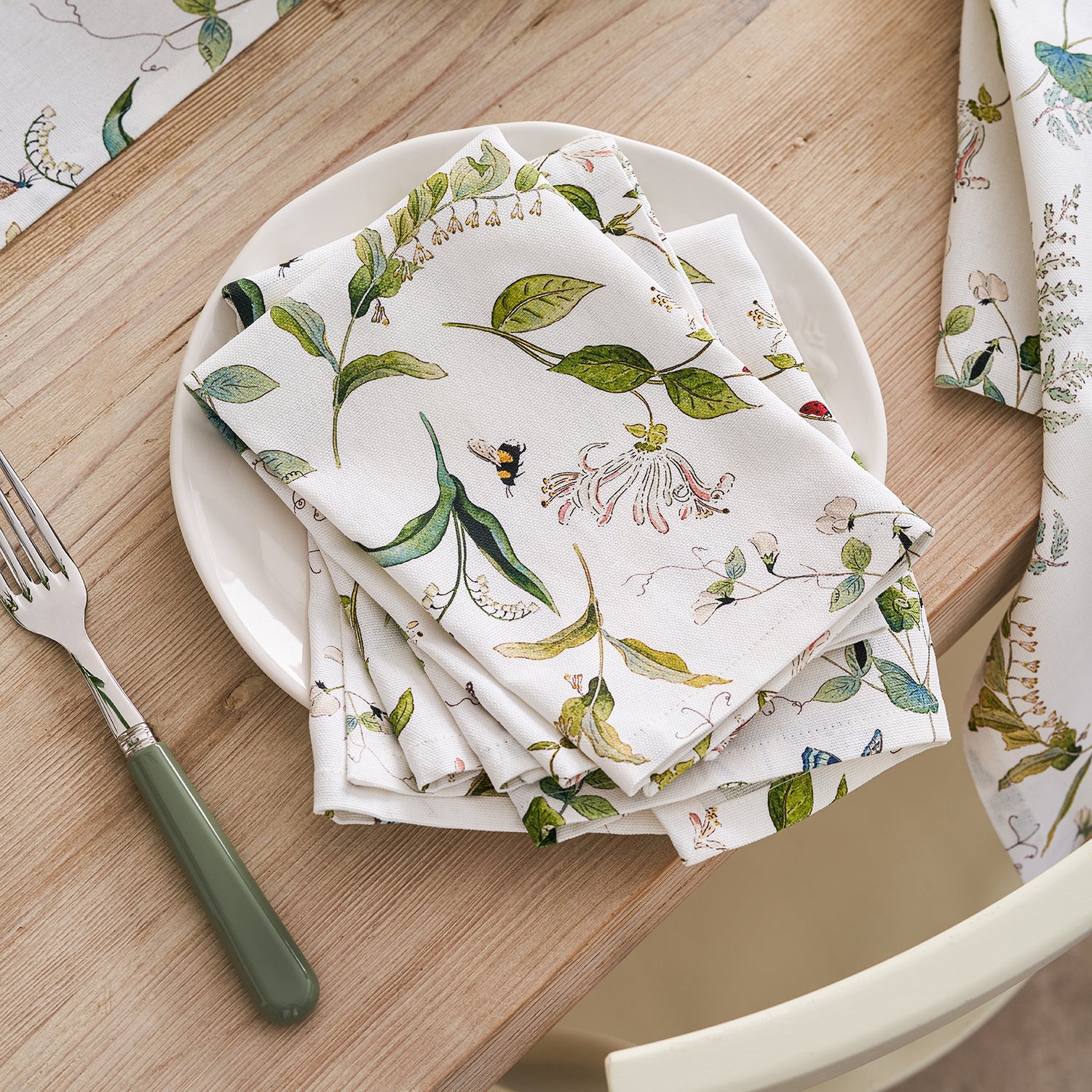 White napkins with floral print by Sophie Allport