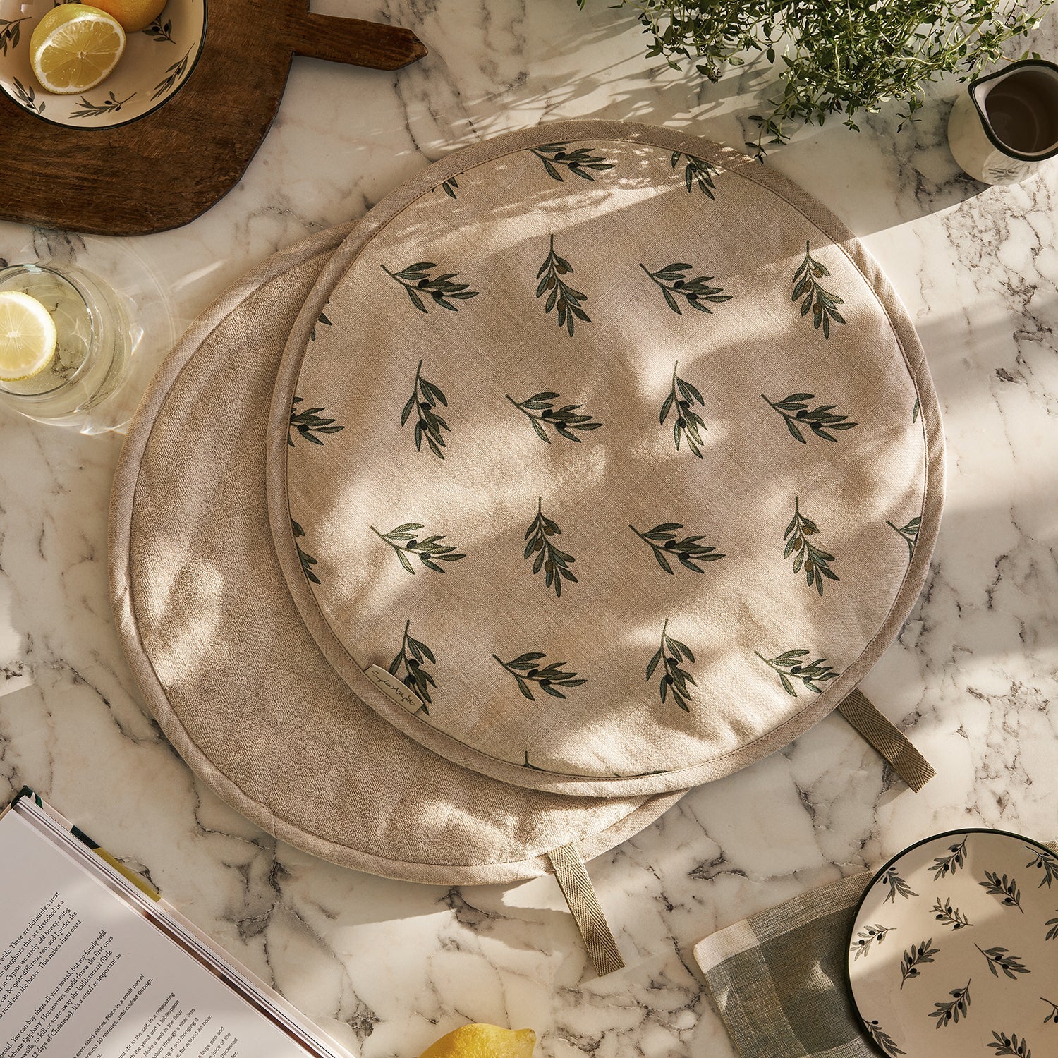 Linen hob covers with olive print by Sophie Allport