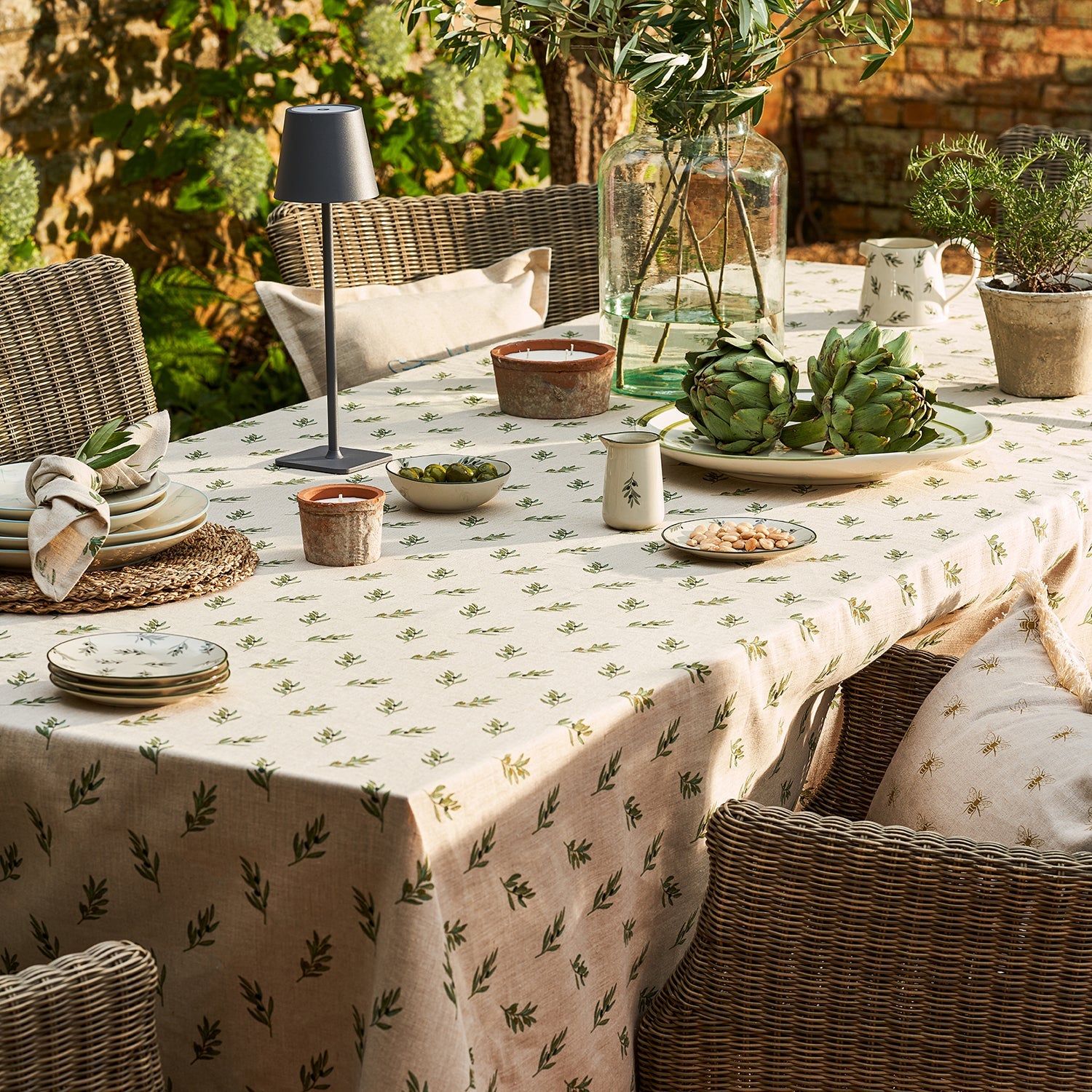 Neutral linen tablecloth with olive print by Sophie Allport