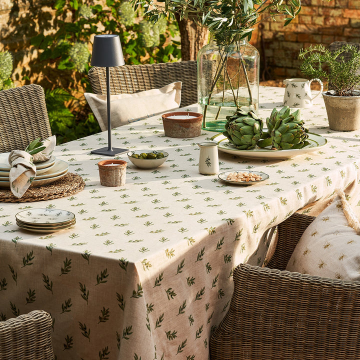 Neutral linen tablecloth with olive print by Sophie Allport