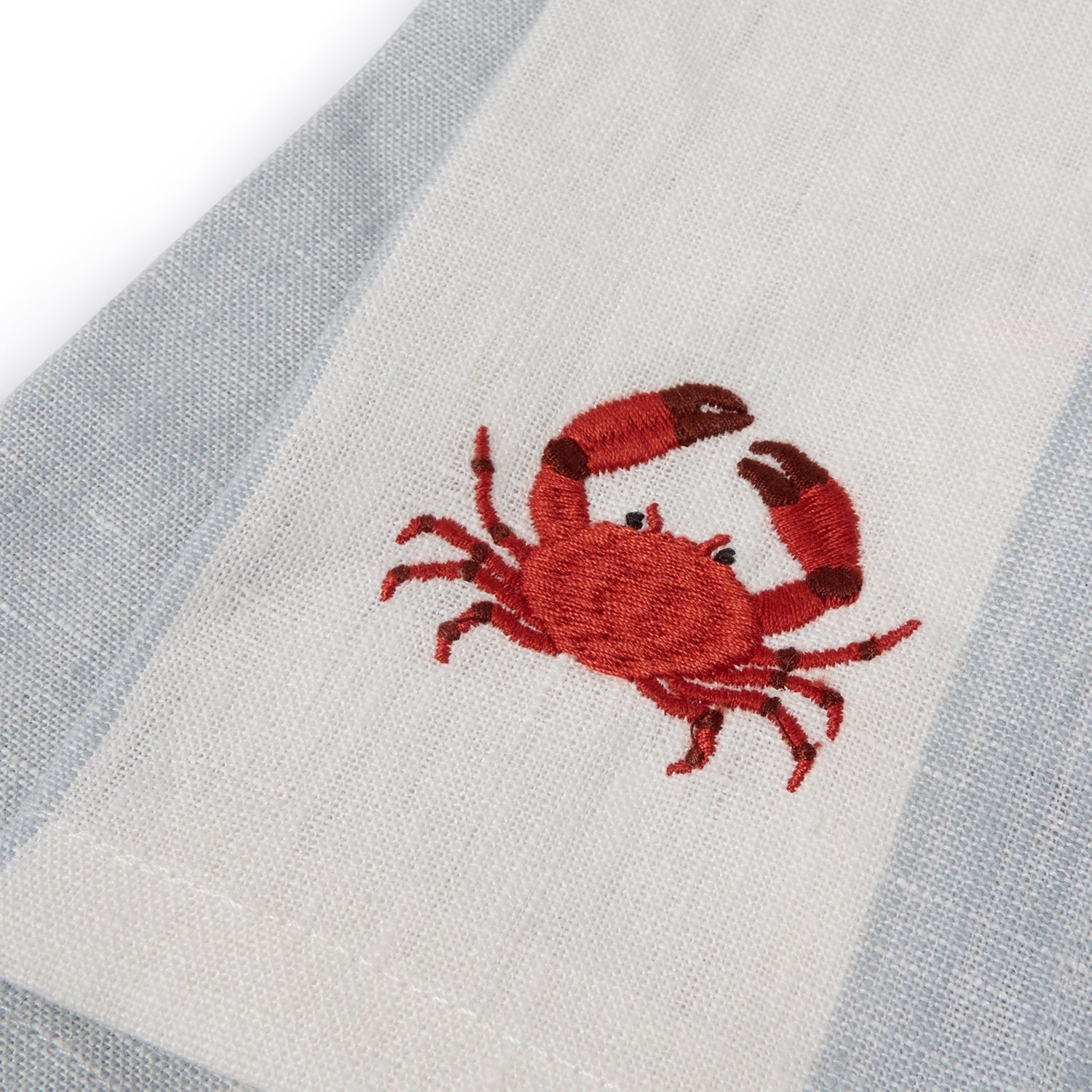 Blue stripe linen napkins with crab prints by Sophie Allport embroidery detail
