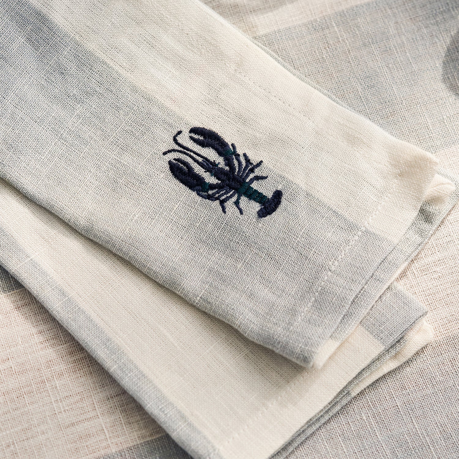 Blue stripe linen napkins with lobster prints by Sophie Allport