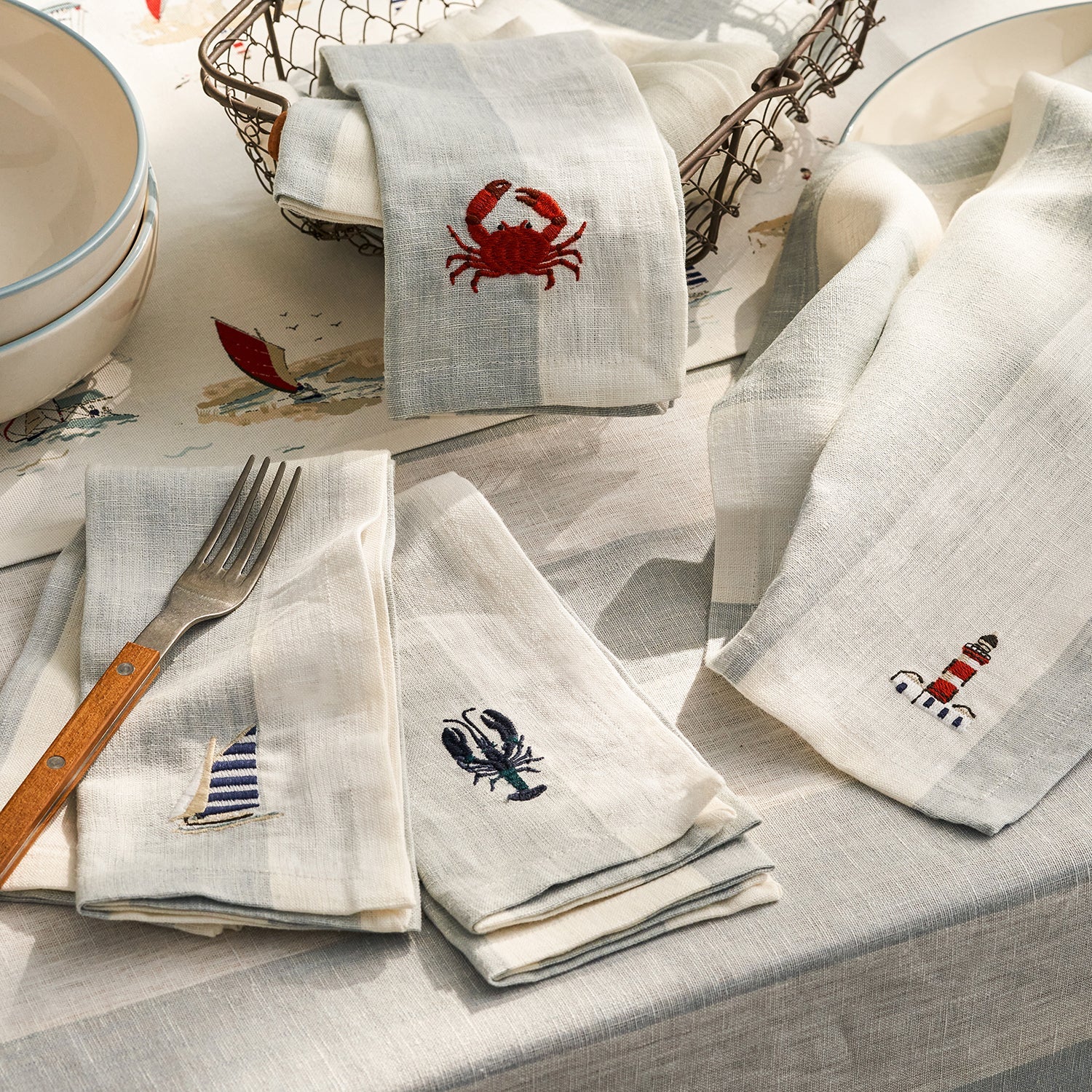 Blue stripe linen napkins with coastal prints by Sophie Allport