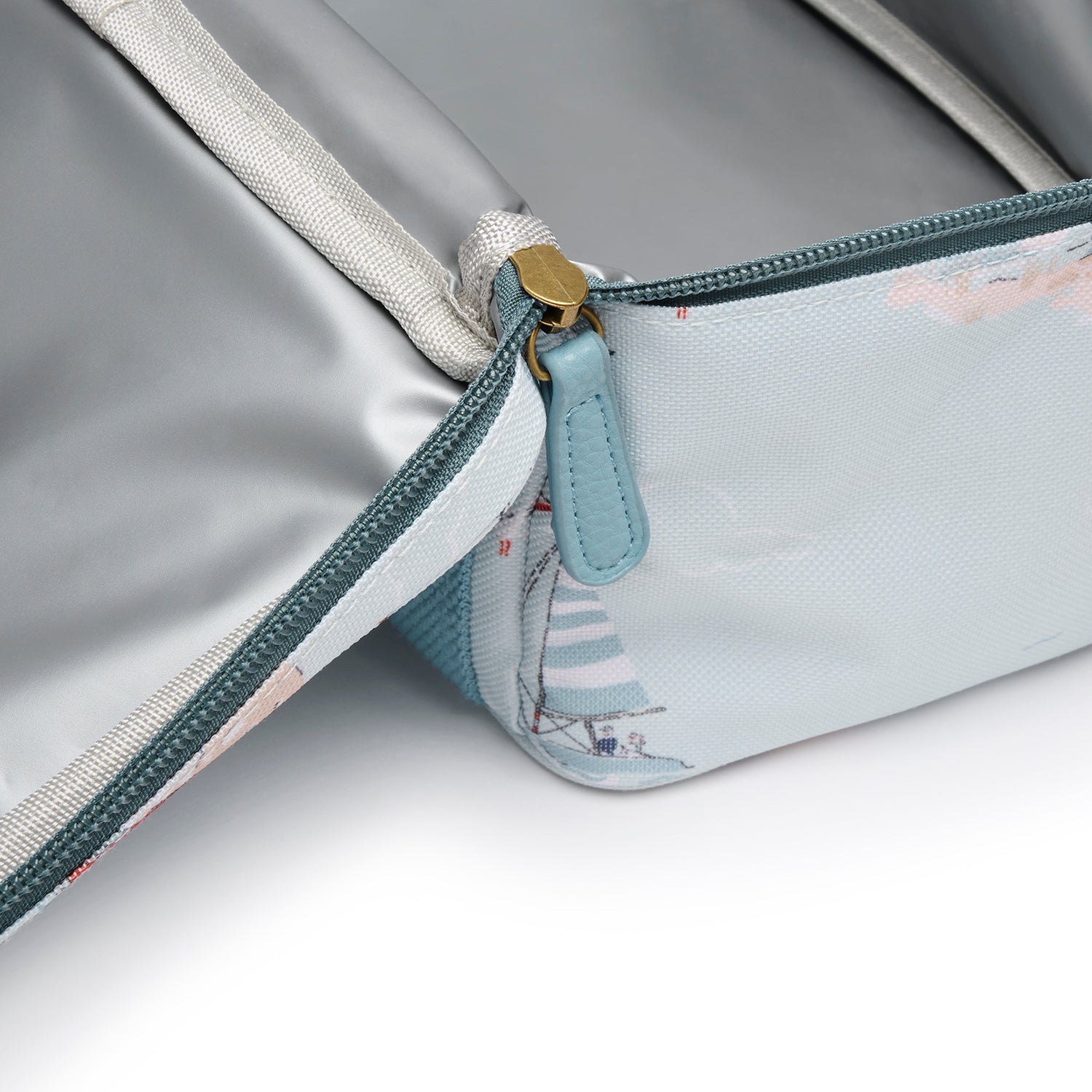 Blue lunch bag with coastal sailing boats print by Sophie Allport zip detail