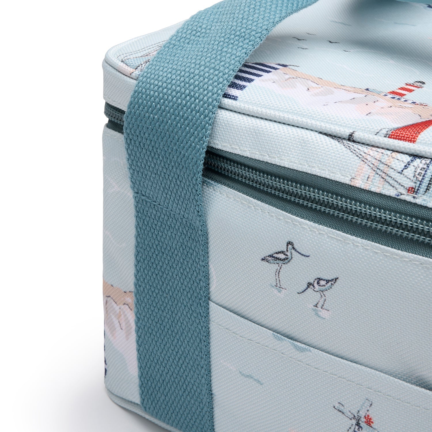 Blue lunch bag with coastal sailing boats print by Sophie Allport strap detail