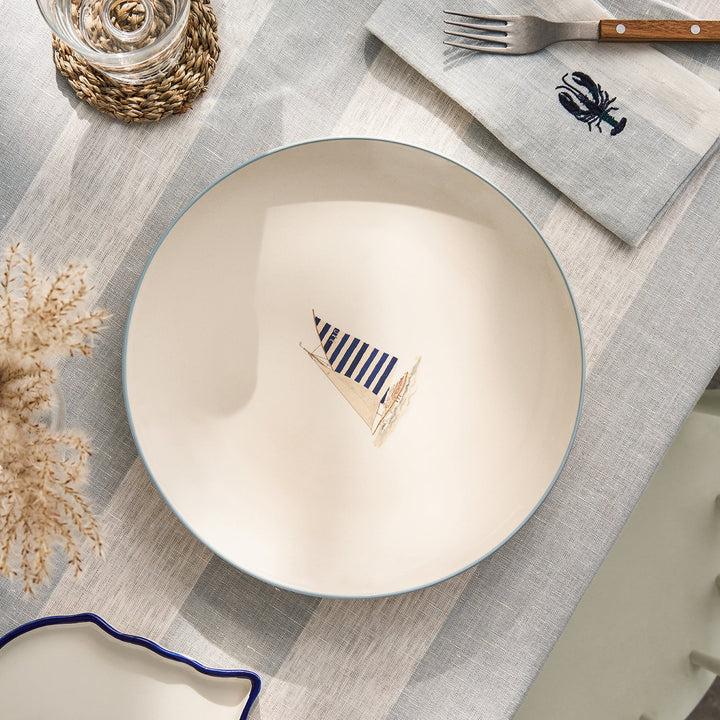 Stoneware dinner plate with blue sailing boat by Sophie Allport
