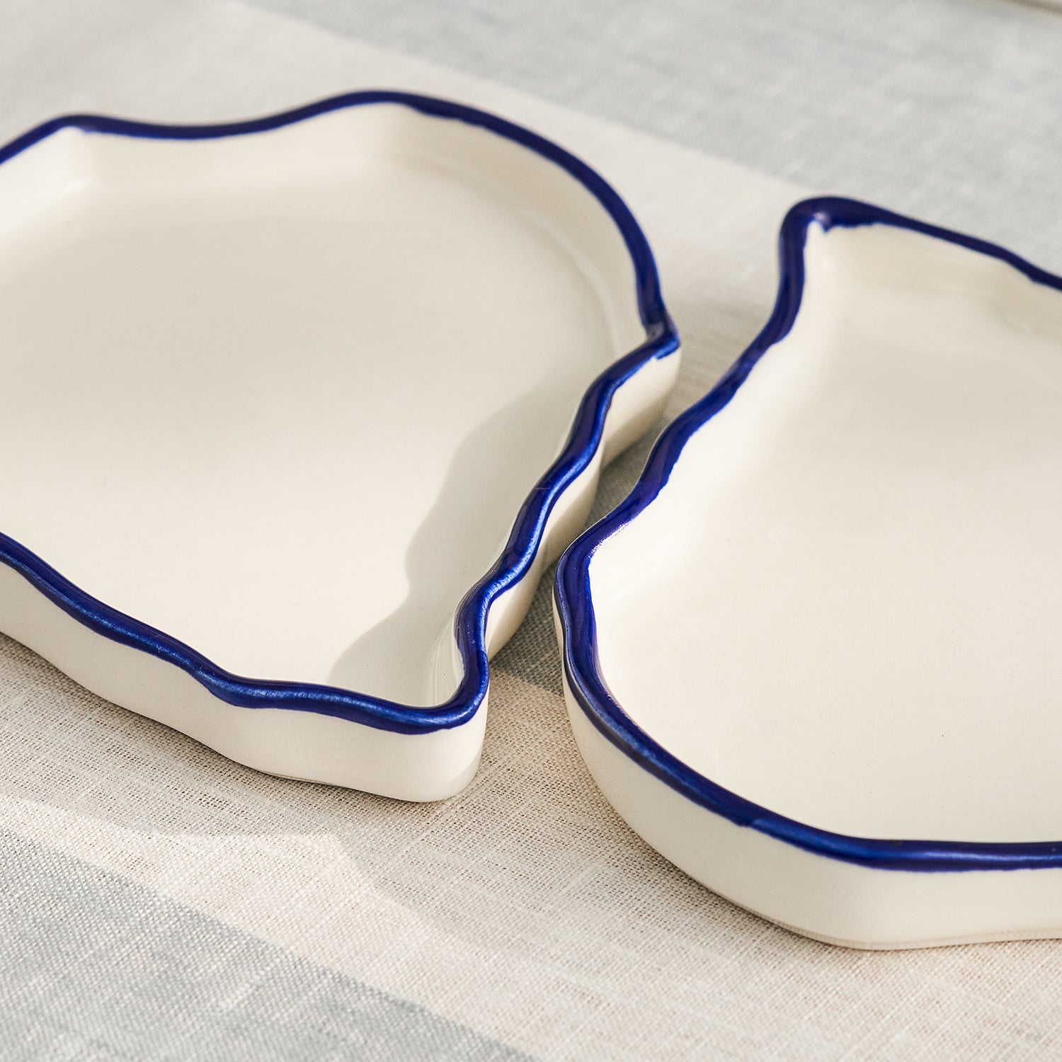 White oyster shape stoneware plates by Sophie Allport detail