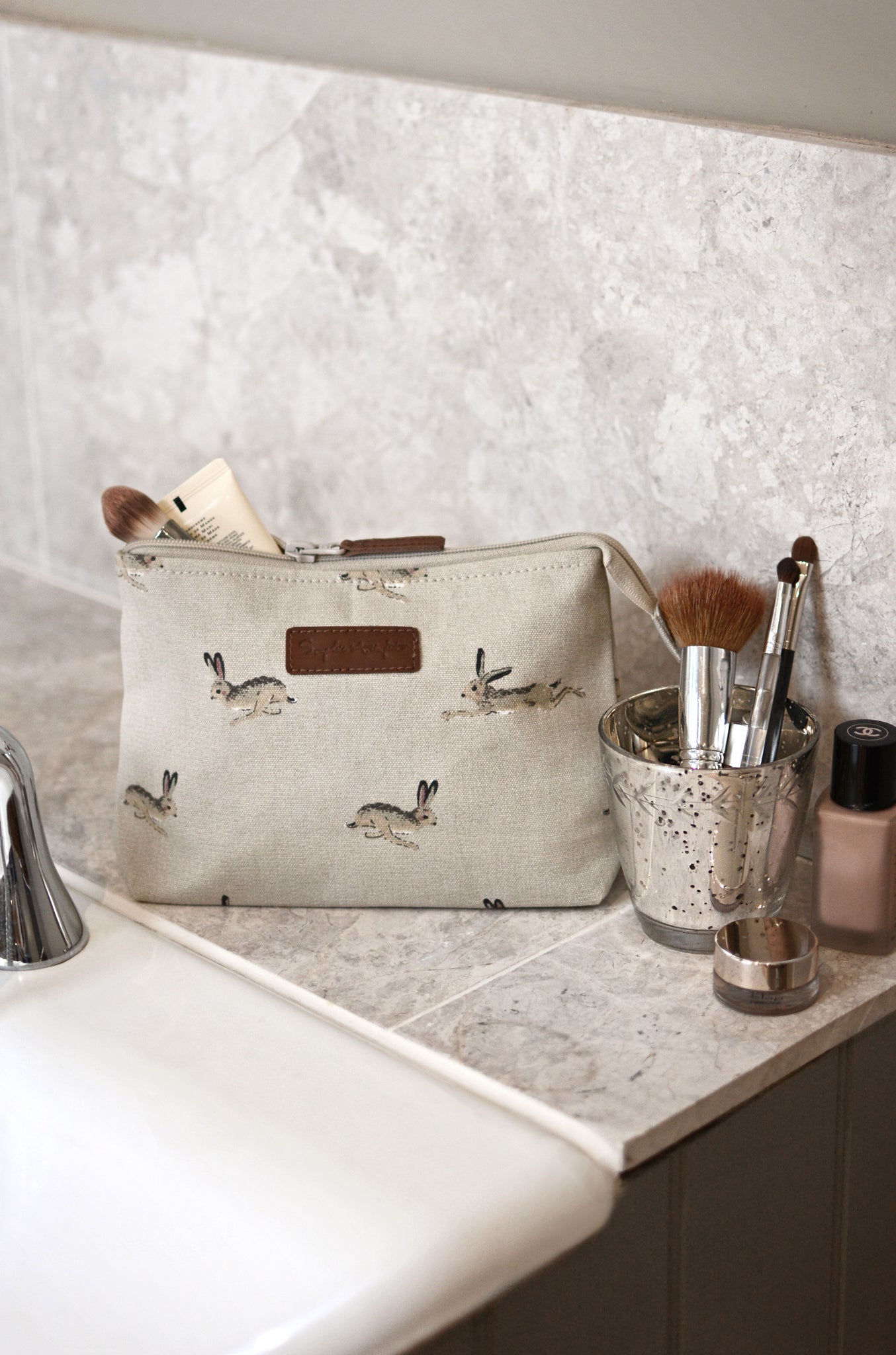 Canvas makeup bag covered in hares