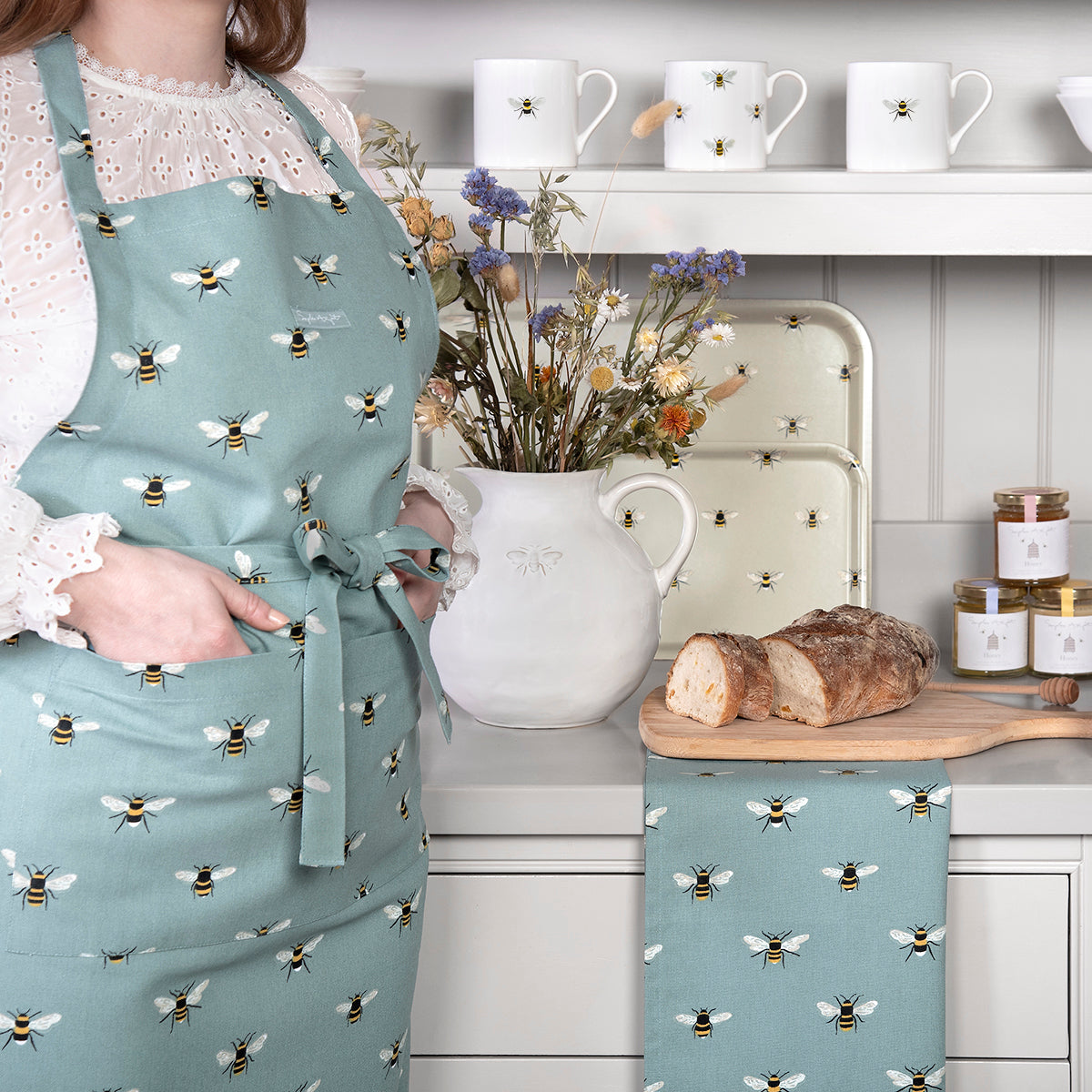 Sophie Allport Bees adult apron in teal design. Perfect gift idea for bee lovers