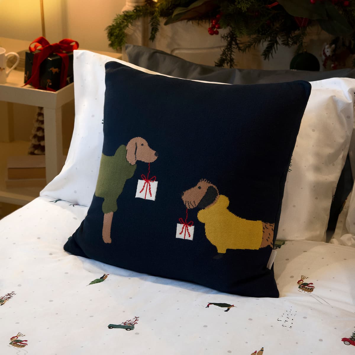 Christmas dogs knitted cushion