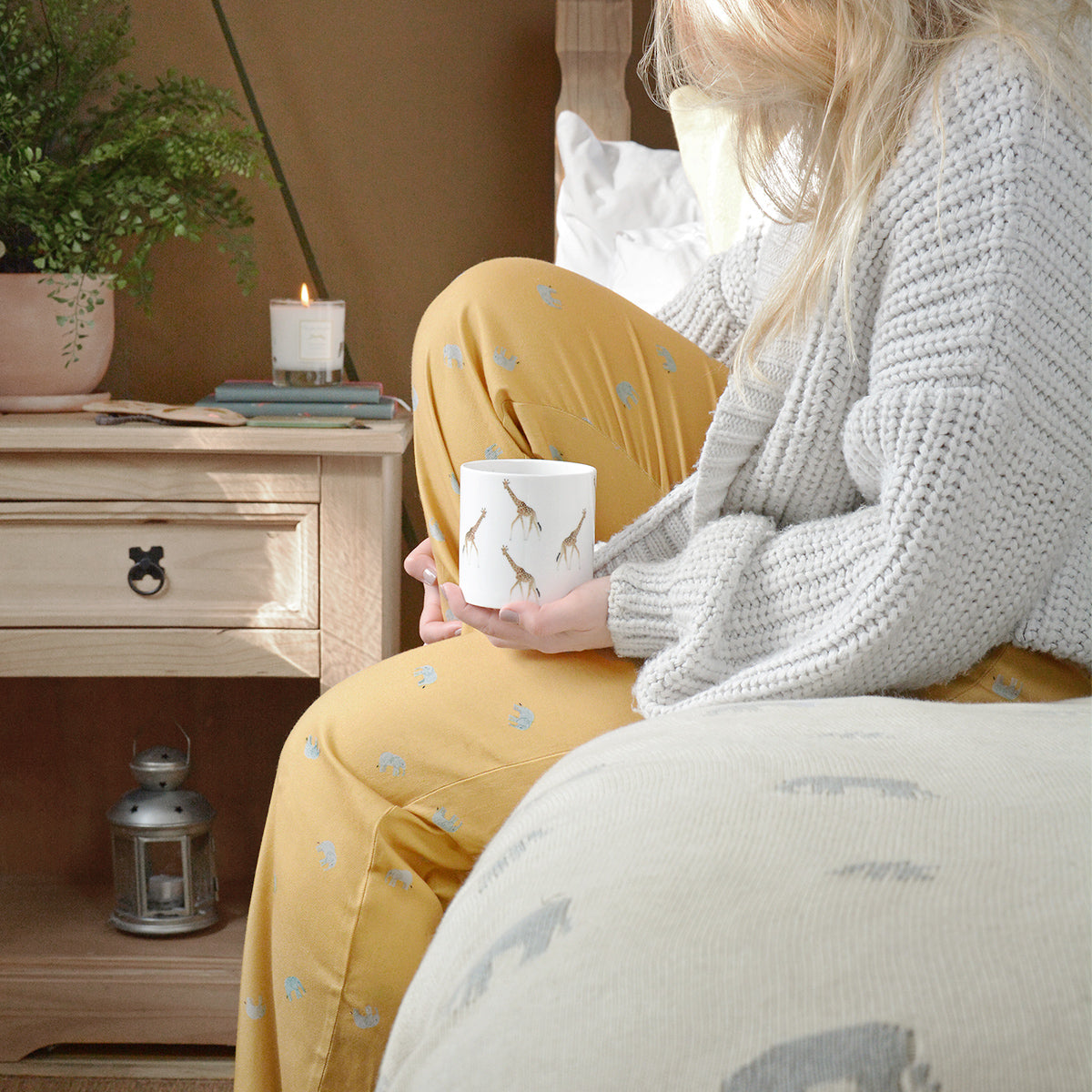 Mustard yellow pyjama bottoms covered in pretty grey elephants