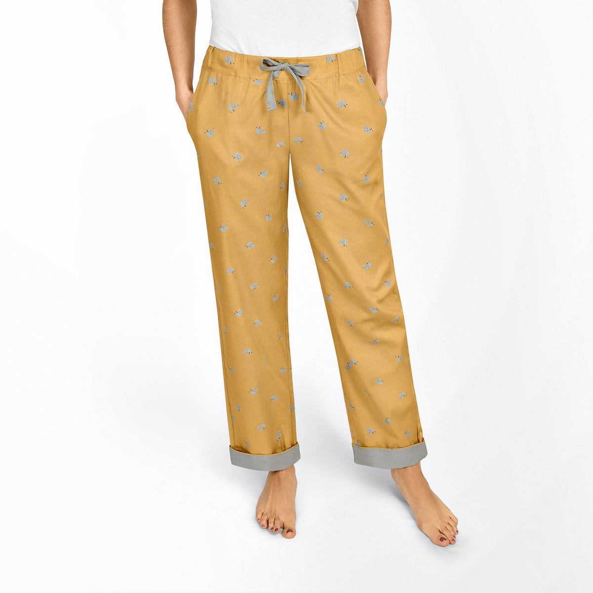 Mustard yellow pyjama bottoms covered in pretty grey elephants